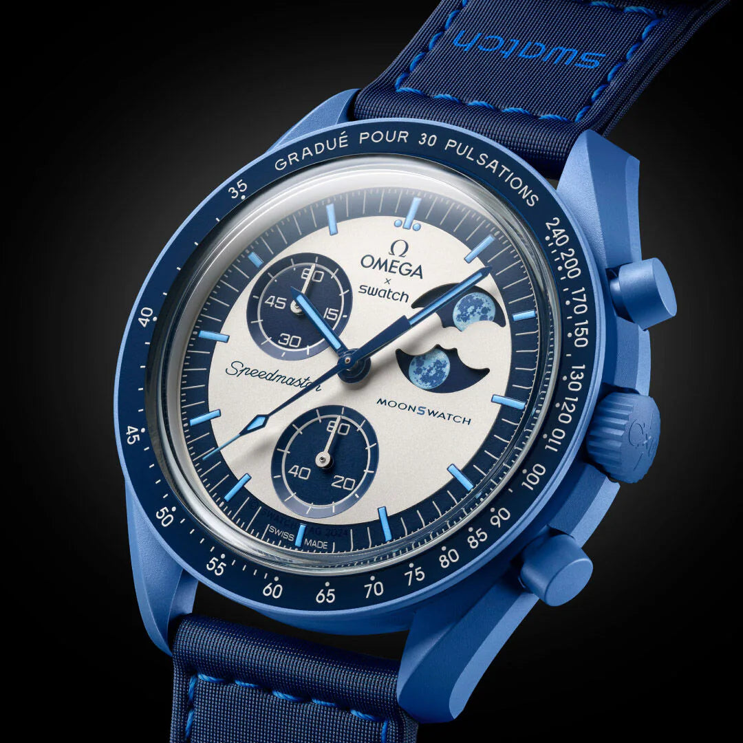 Blue Omega watch with detailed face on a dark background